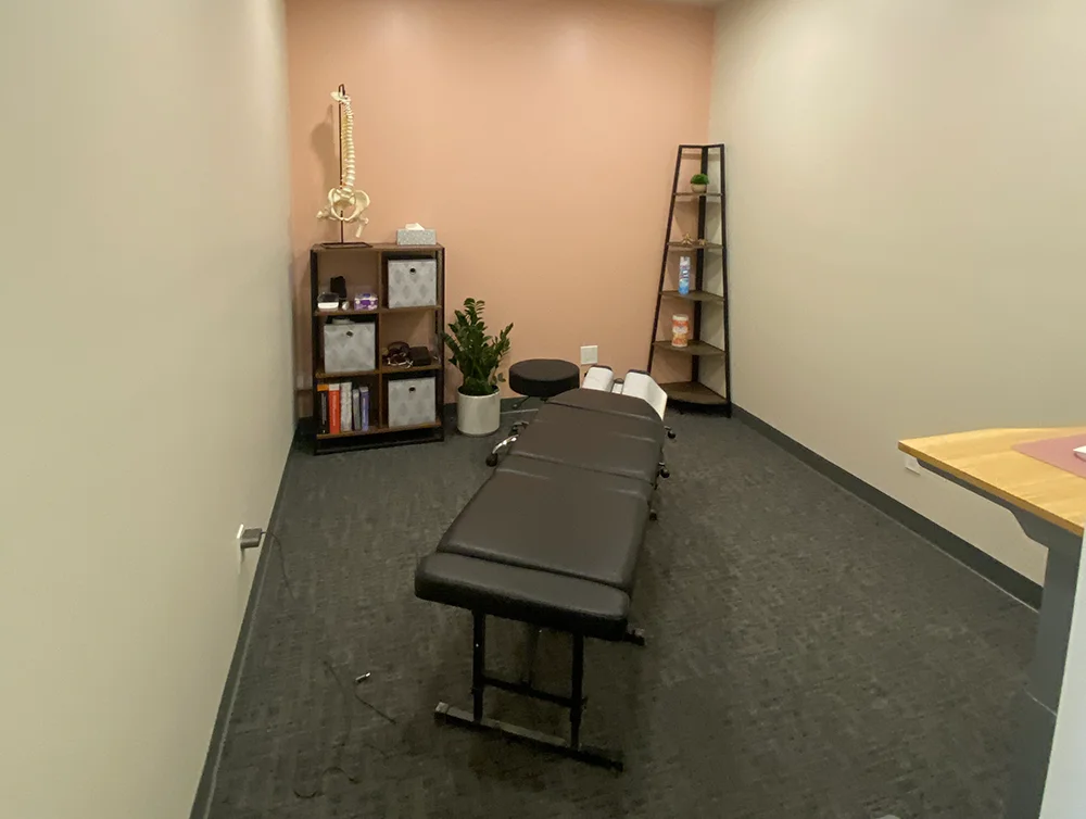 Procedure room of a chiropractor salon remodeled by Global Arch Construction