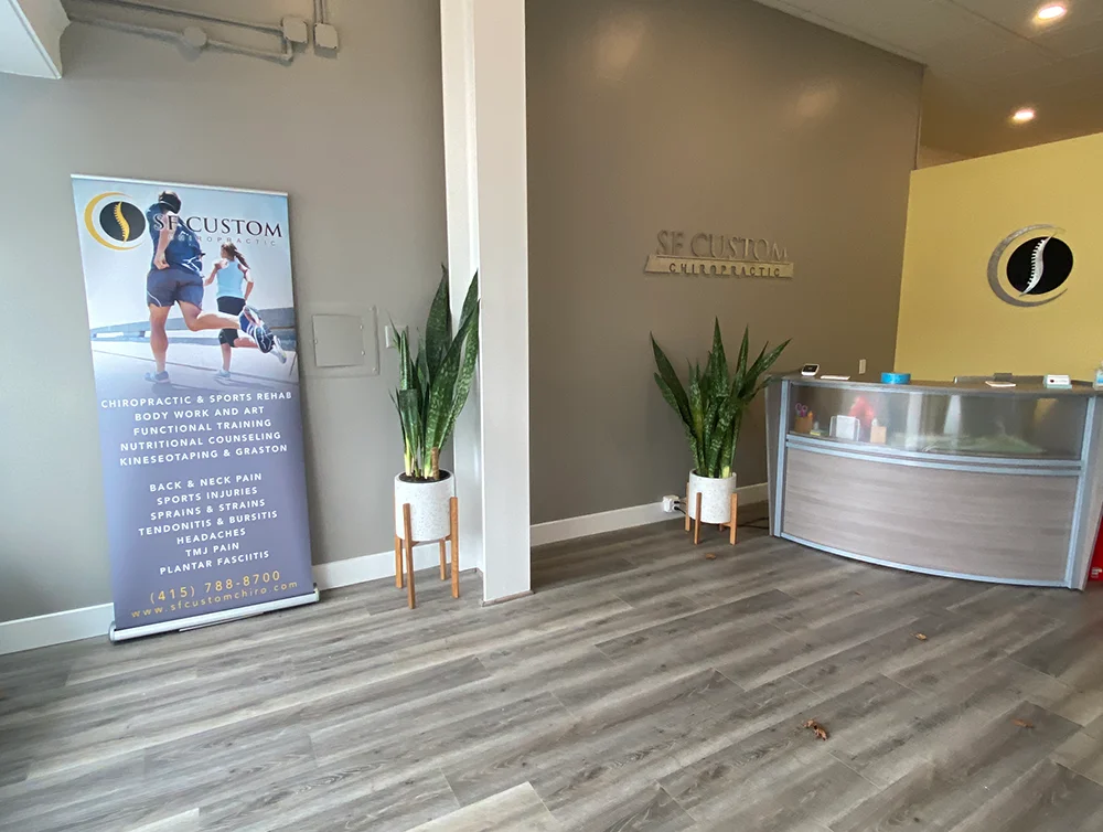 Front desk of a chiropractor salon remodeled by Global Arch Construction