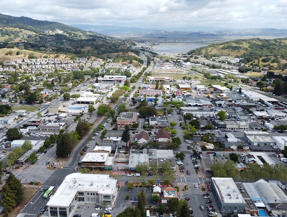 Aerial (drone) view of Novato, California looking north along Redwood Ave toward San Marin, Mt Burdell and Petaluma. Downtown Novato is in the foreground.