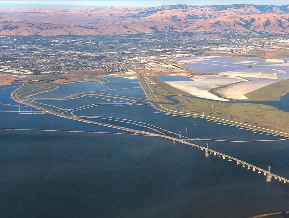Aerial View of San Mateo Bridge in San Francisco Bay Area towards Burlingame, CA.