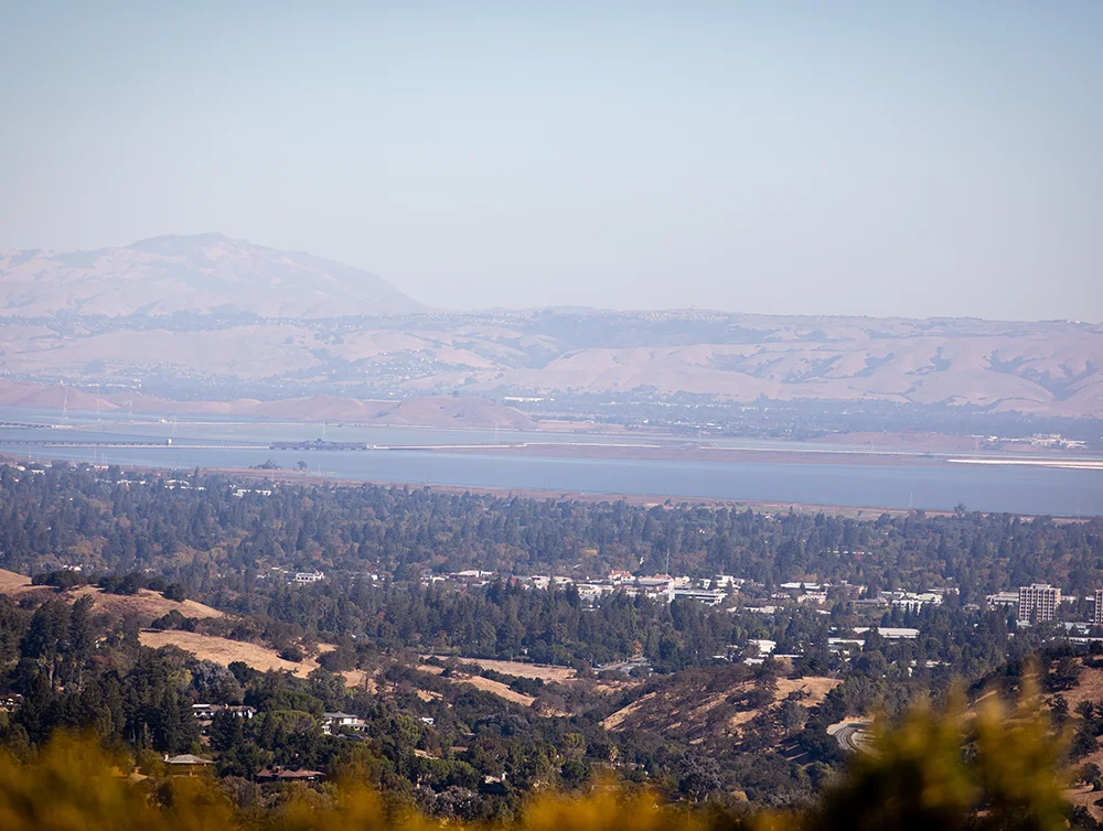 San Francisco Bay Area, East Bay mountains, and cities of Silicon Valley seen from vista point at Foothills Nature Preserve in Los Altos Hills