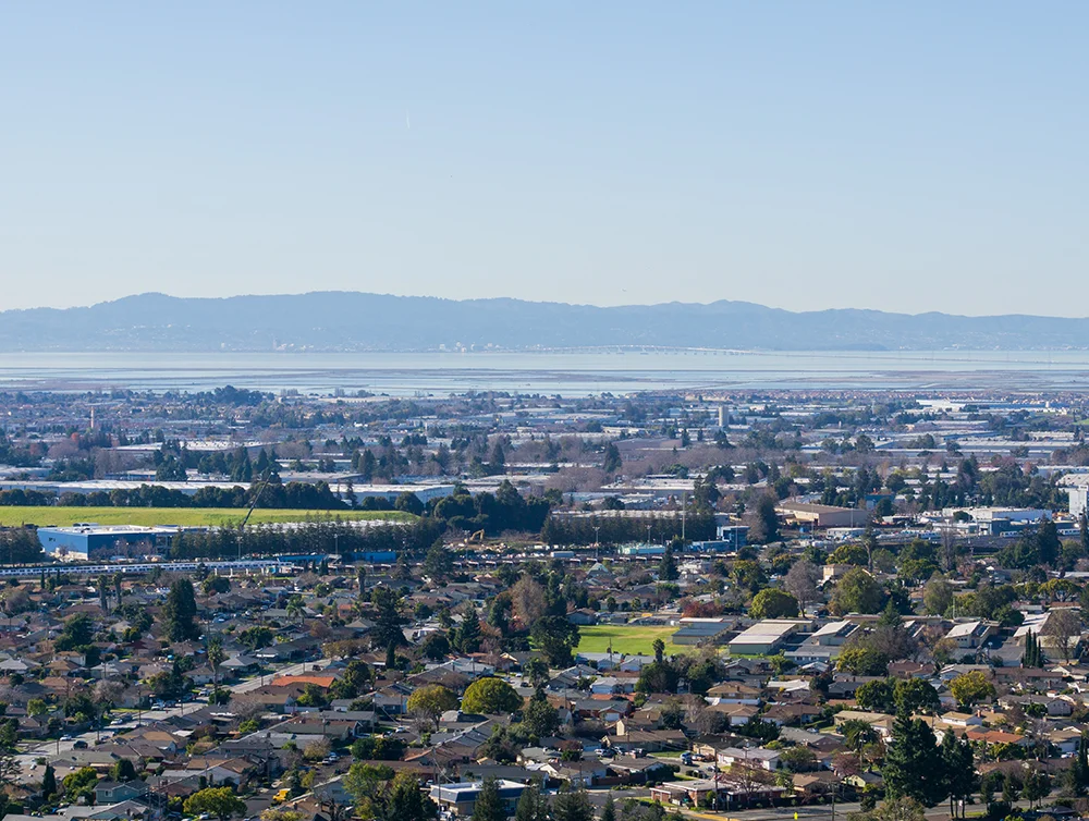 View towards the towns of east bay; San Mateo bridge on the background, San Francisco bay area, Hayward, California