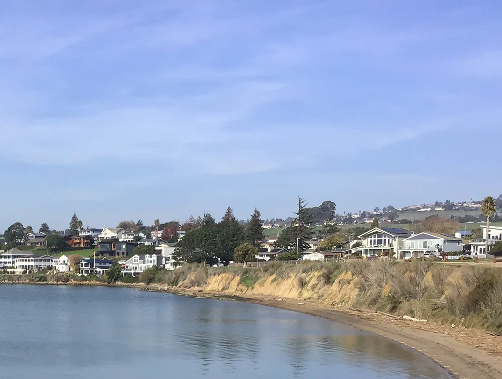View of Benicia, California located on mountain in front of it have the sea and blue sky are background