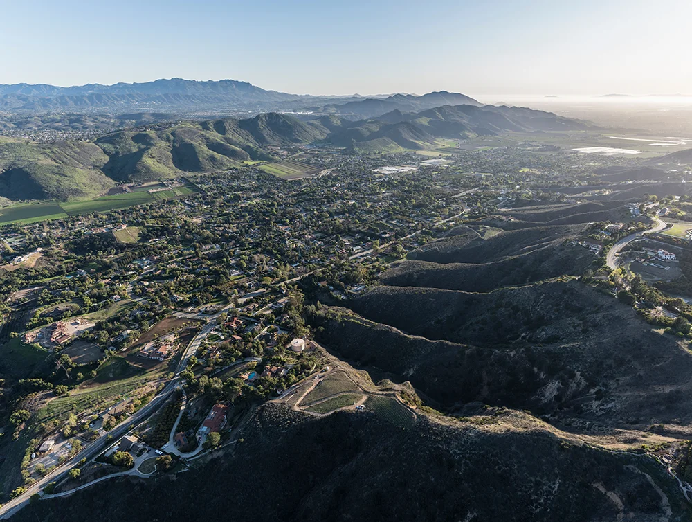 Afternoon aerial view of Santa Rosa Valley homes and hillsides in the Camarillo neighborhood of Ventura County California.