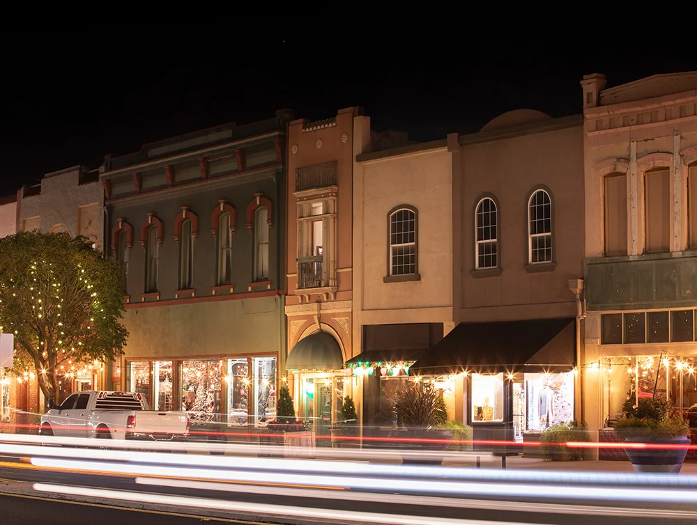 Night time traffic streams through historic downtown Red Bluff, California, USA.