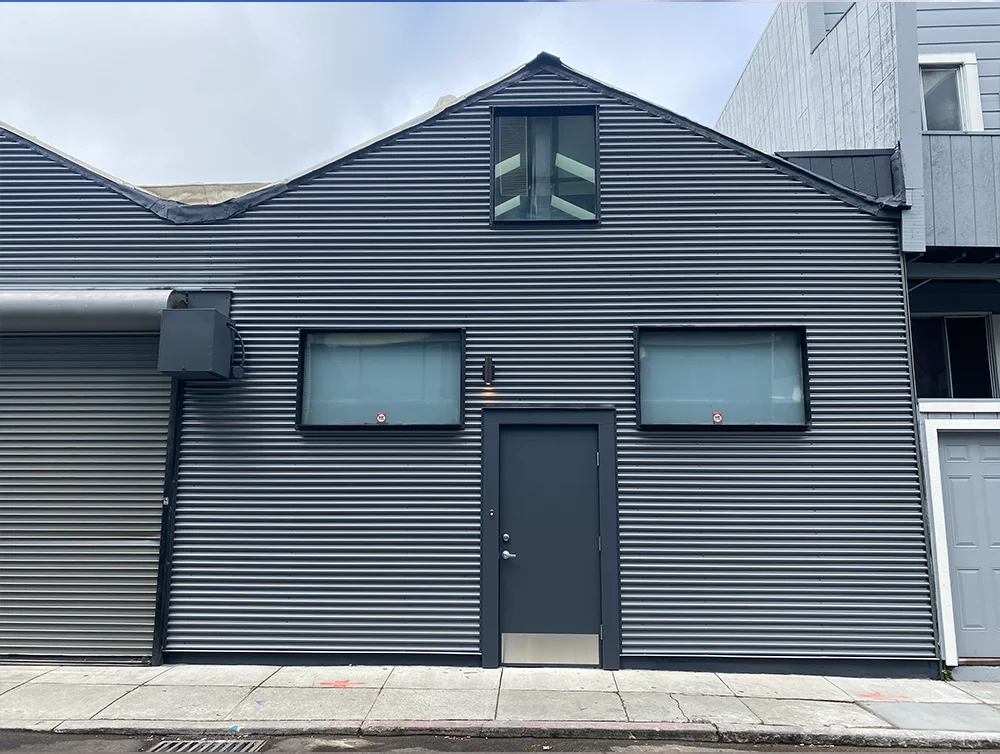 Entrance of an apartment complex renovated by global arch construction.