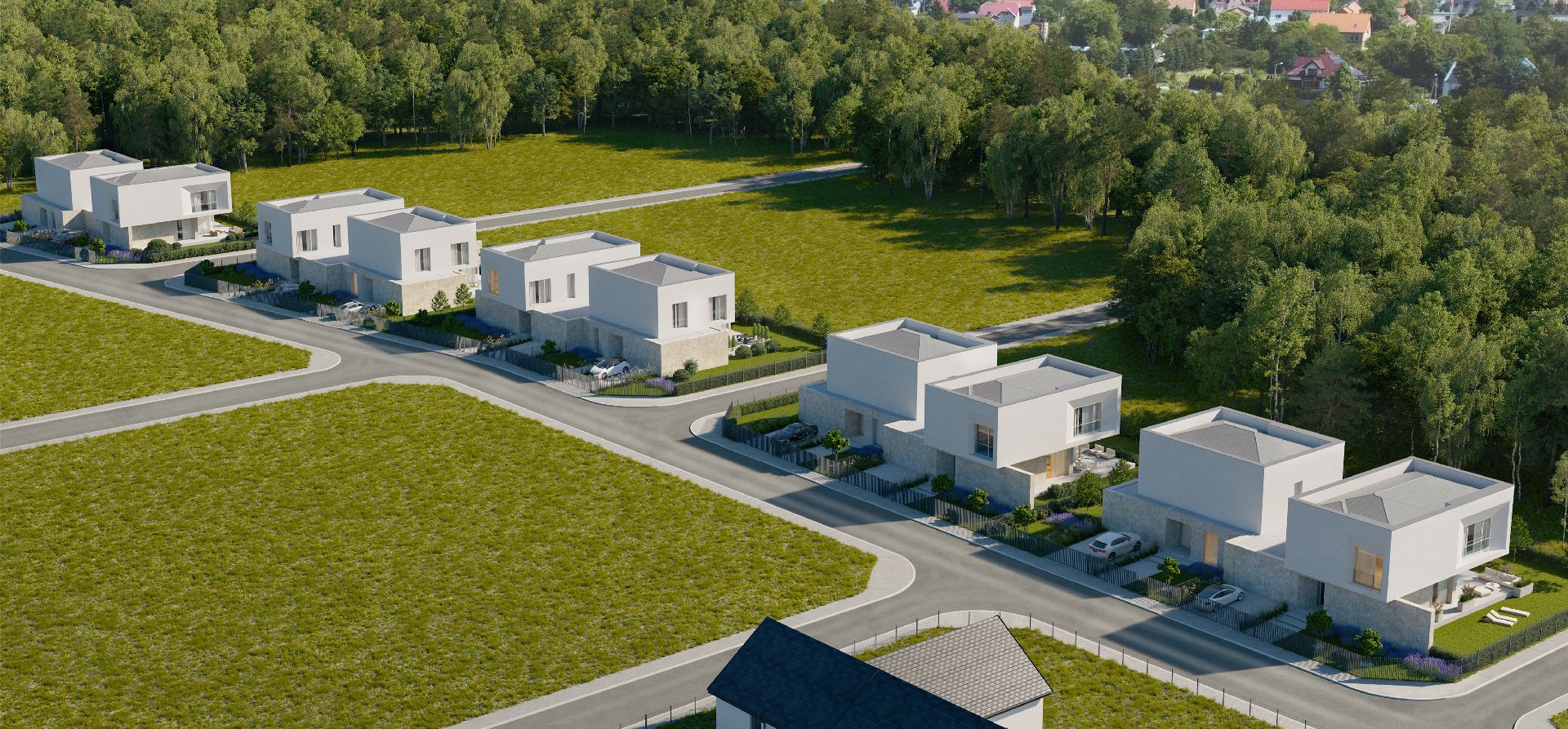 Osiedle nowoczesnych domów typu bliźniak z jasną elewacją i kamiennym wykończeniem parteru, usytuowane wzdłuż drogi, graniczące z terenami zielonymi i lasem, widoczne z lotu ptaka.