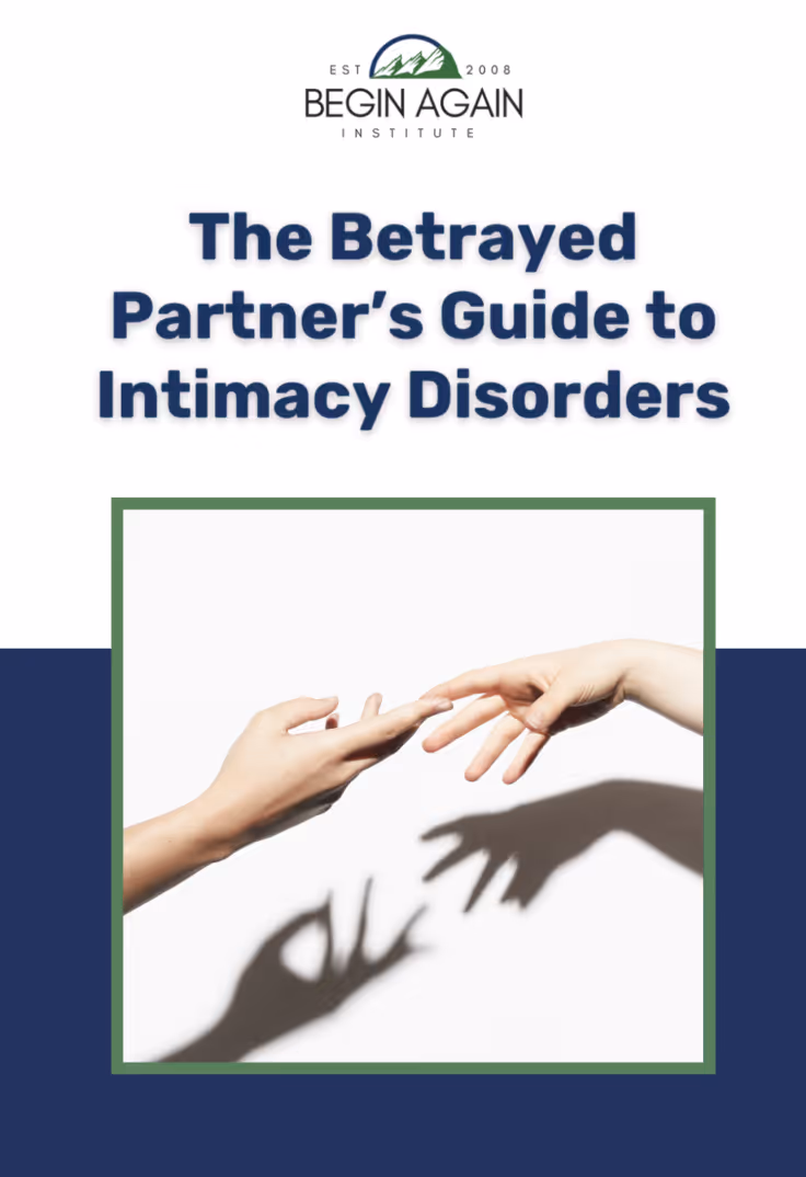 Cover of a guide titled 'The Betrayed Partner's Guide to Intimacy Disorders' with two hands reaching toward each other and their shadows forming different shapes.