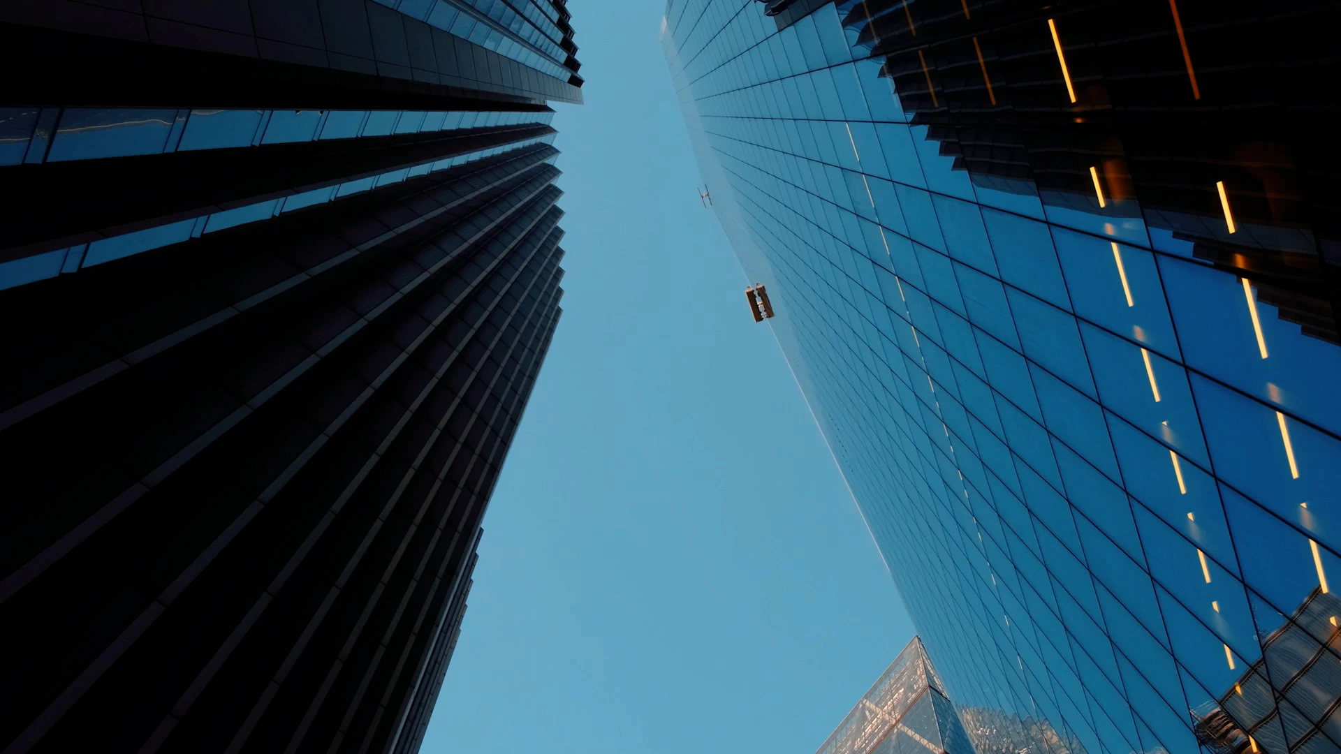 a tall building with a street light in the middle of it