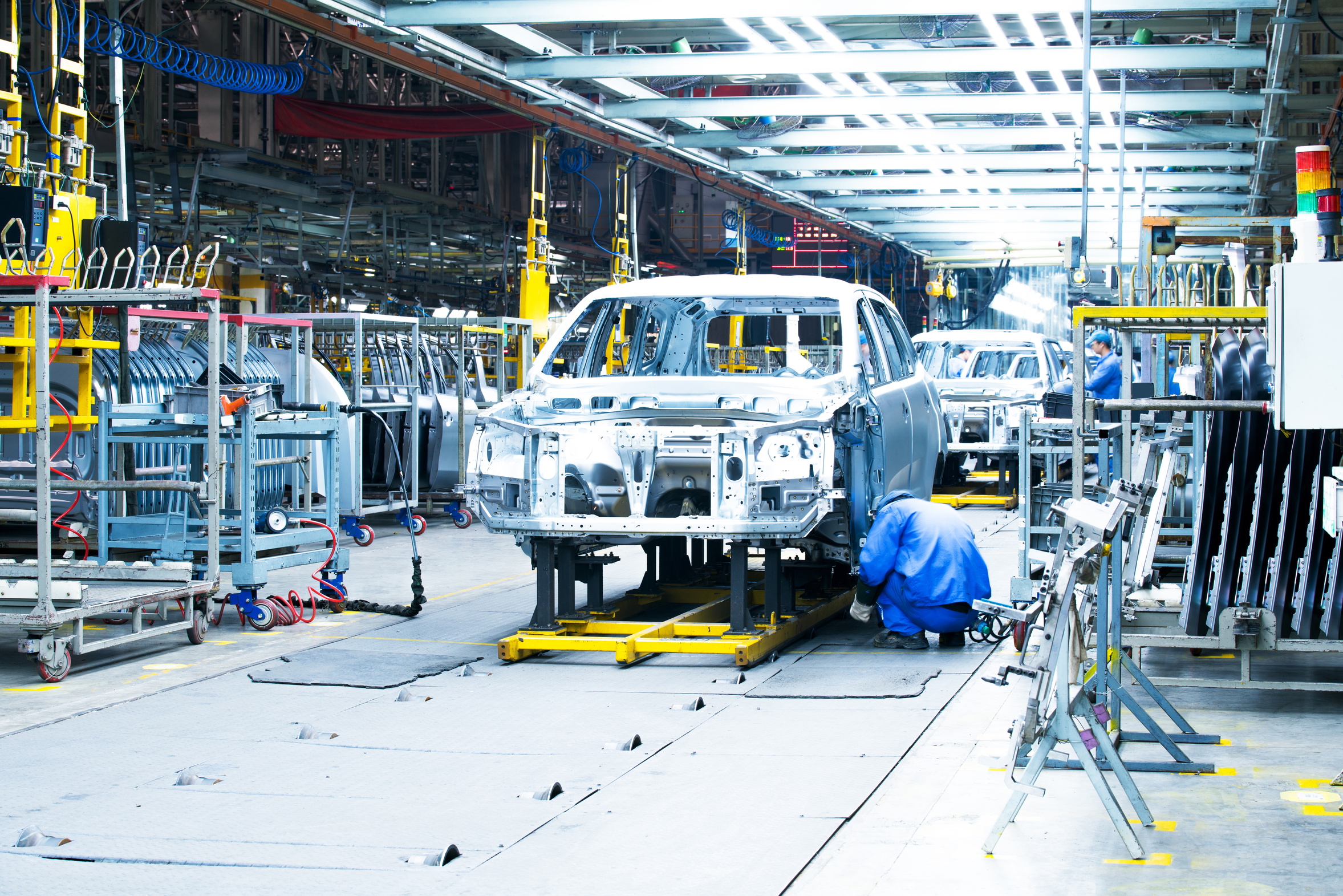 Workers on a car production line
