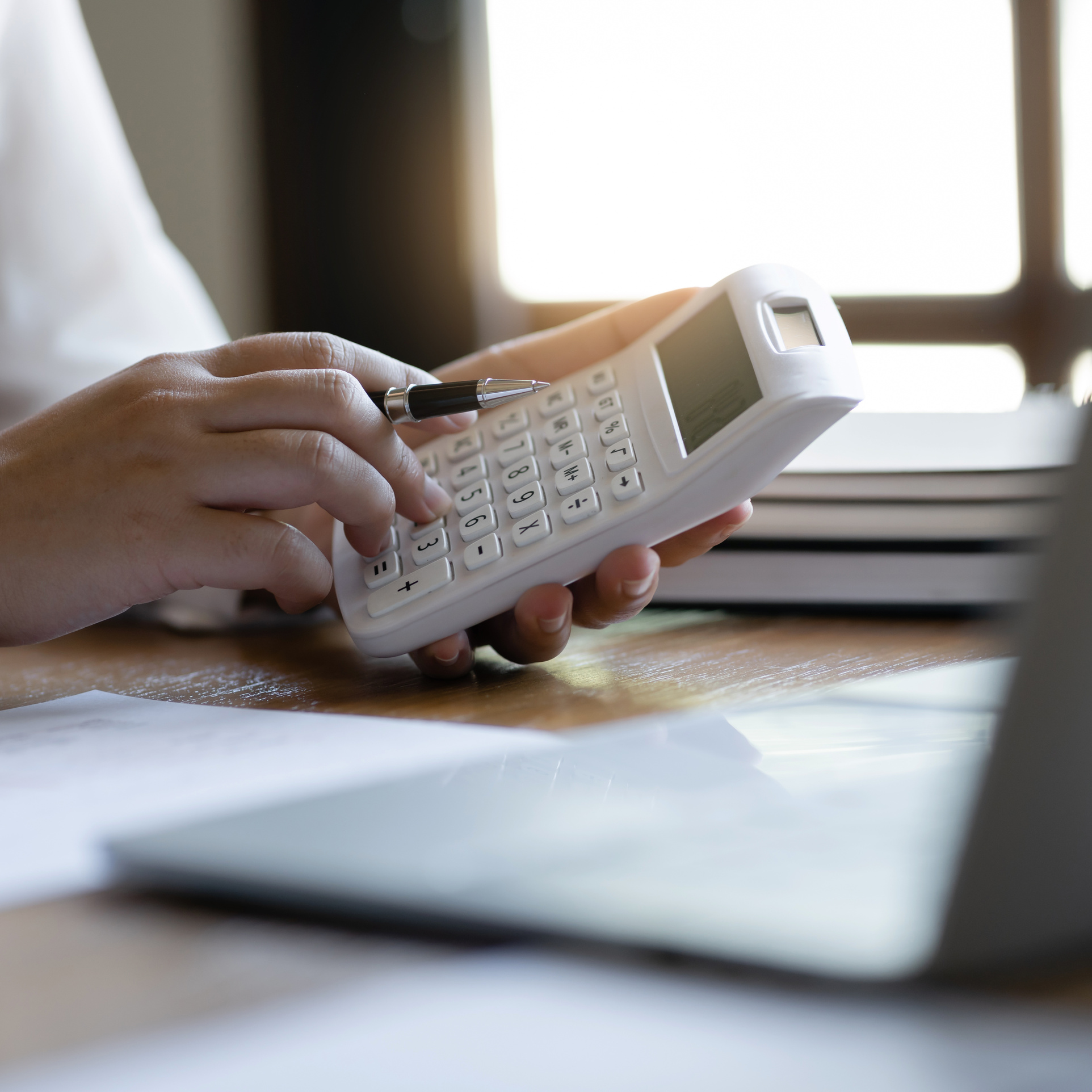 Accountant calculating invoices and tax
