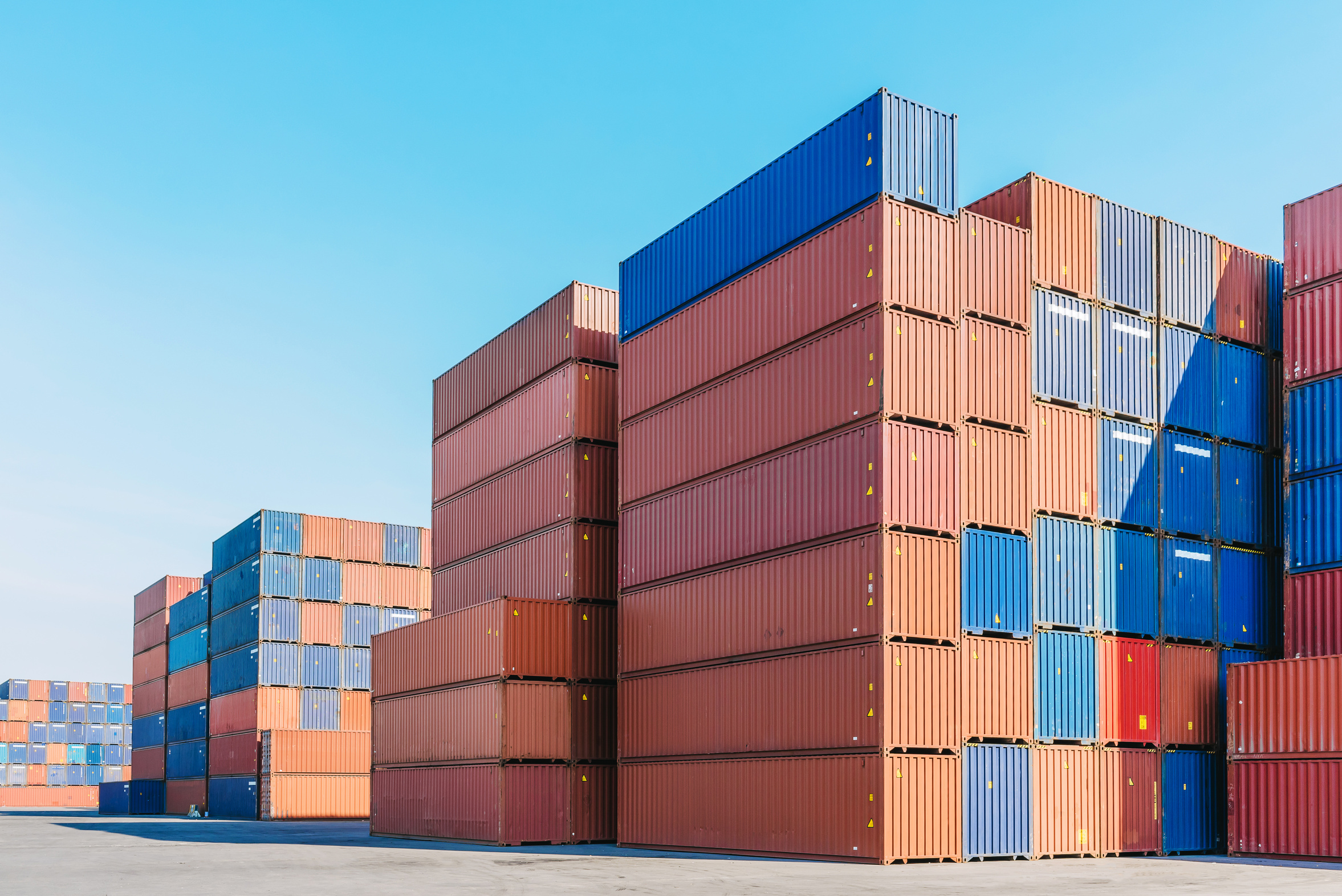 Industrial port with stacked shipping containers