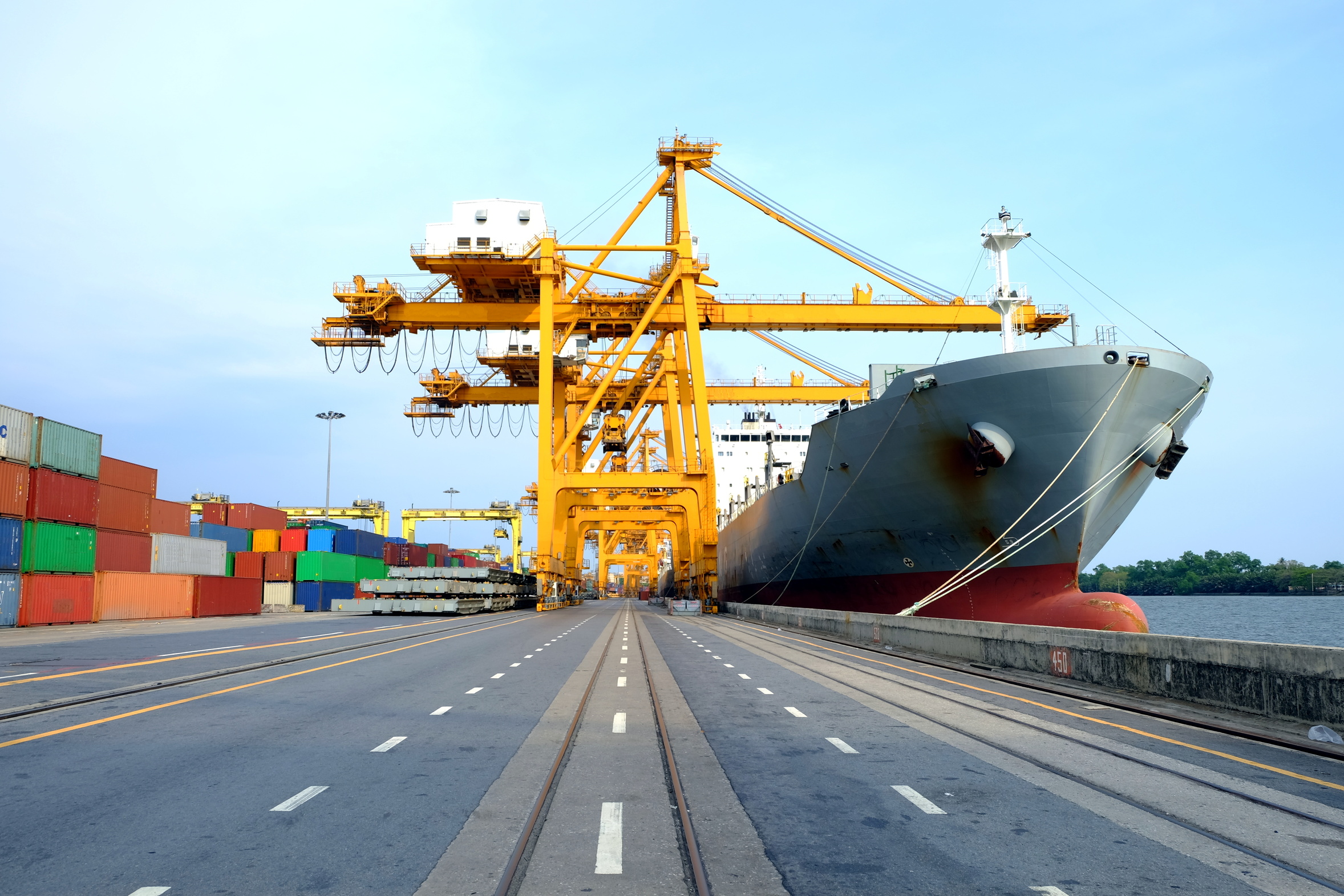Gantry cranes unloading a container ship at the quay