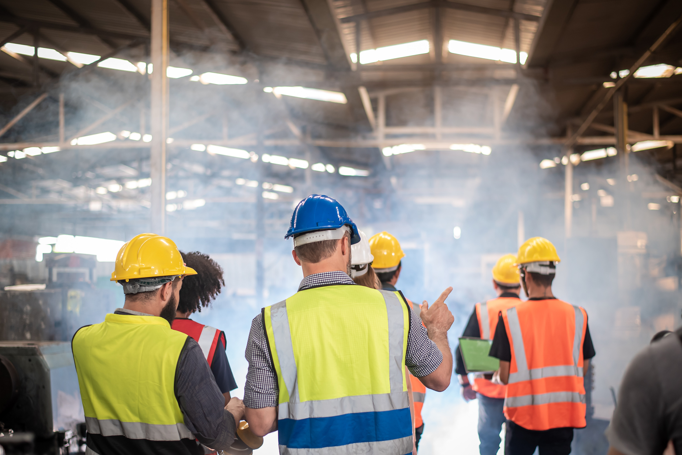 Management team walking the factory floor