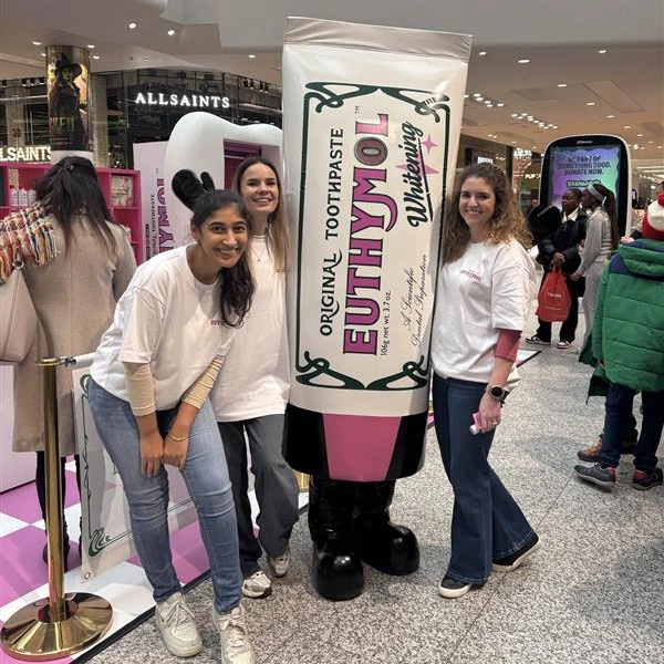 Euthymol Whitening Toothpaste experiential activation at Westfield White City featuring a giant product prop and mascot alongside Kith&Kind PR's creative service description. This illustrates how immersive brand experiences and viral stunts deliver guaranteed impact.