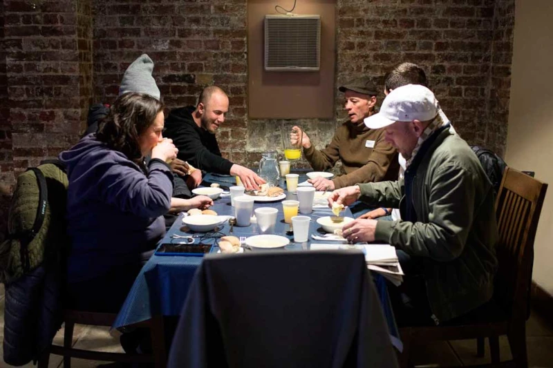 Volunteers serving food at a charity, reflecting genuine ESG and purpose-driven communications
