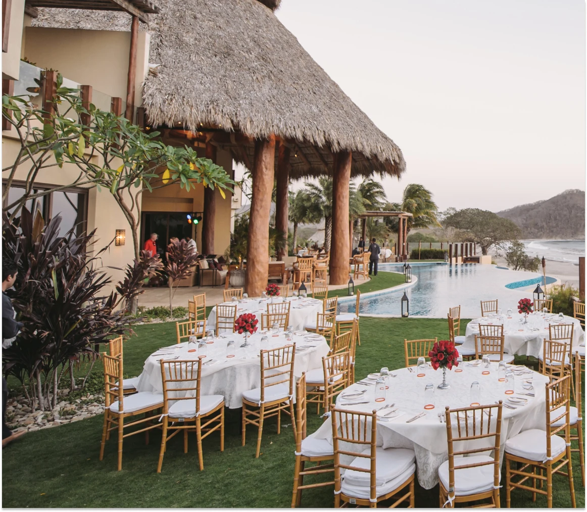 Elegant-outdoor-wedding-reception-at-Mukul-Resort-featuring-oceanfront-views-and-beautifully-set-dining-tables