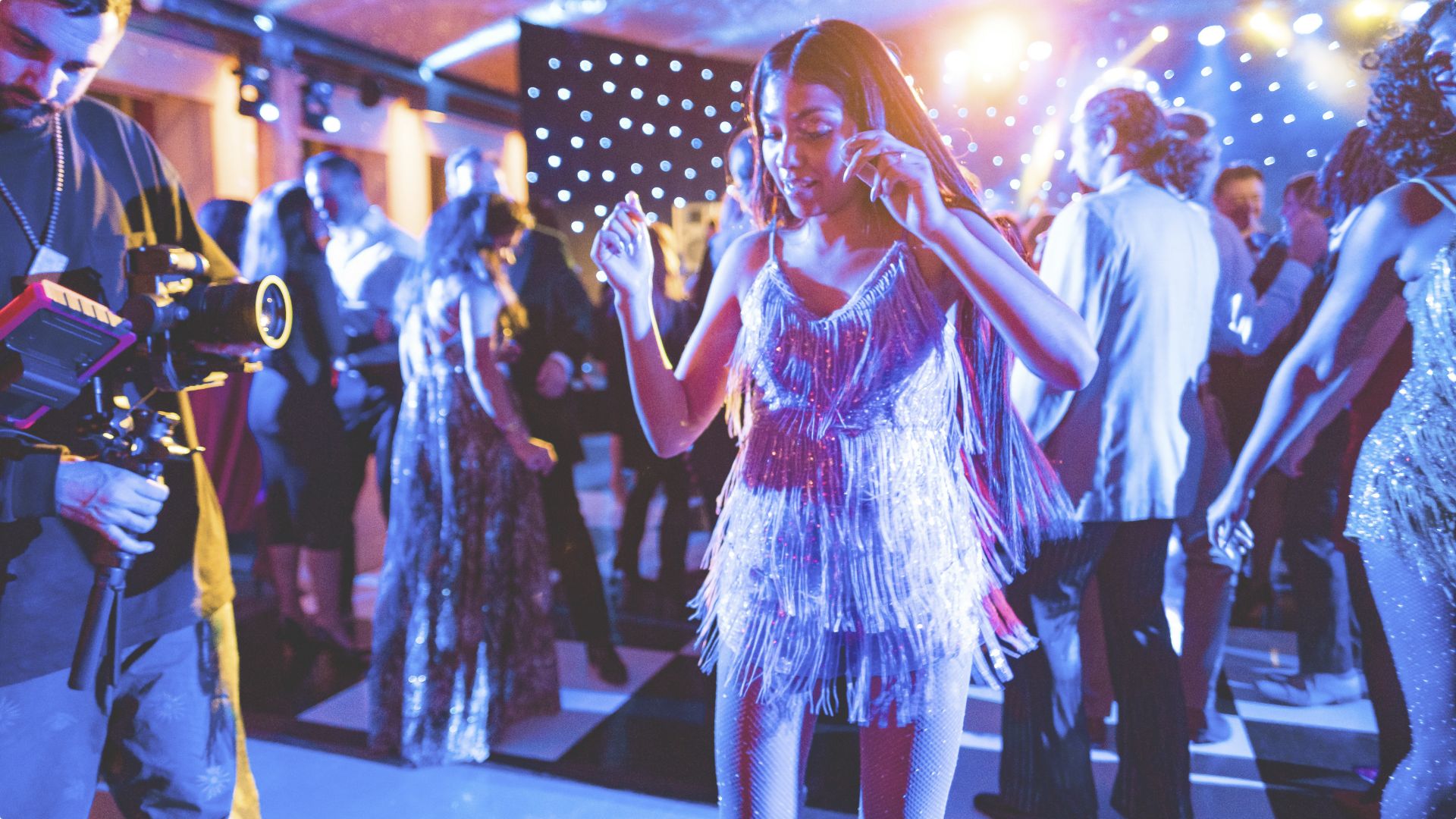 Upscale party scene with live band, dynamic stage lighting, and guests in cocktail attire enjoying the atmosphere at a Contak AV event