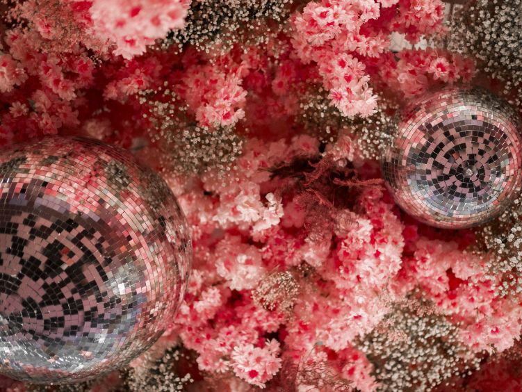 Hanging floral arrangement with mirrored disco balls showcasing Contak AV's bespoke ceiling installations and decor inventory