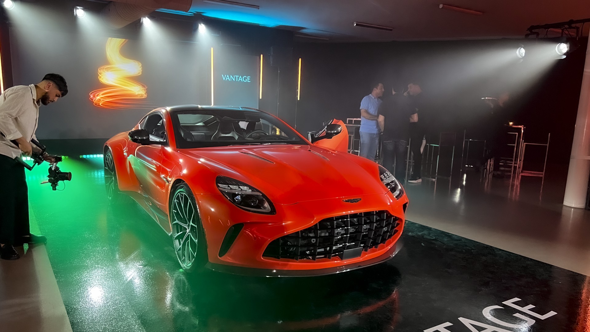 Aston Martin Vantage product launch in Montreal with LED tube lighting, professional photo lighting, and dynamic projection mapping visuals.