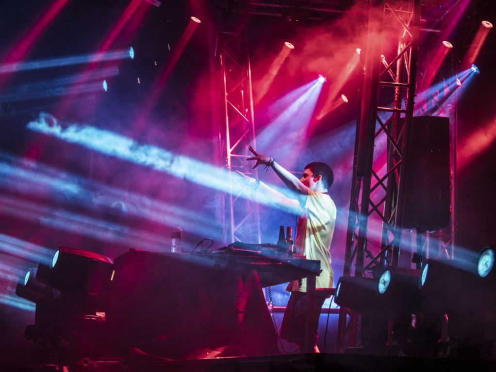 Live DJ show in Montreal with synchronized lighting display, moving beam lights, and full audiovisual setup for cultural or nightlife events