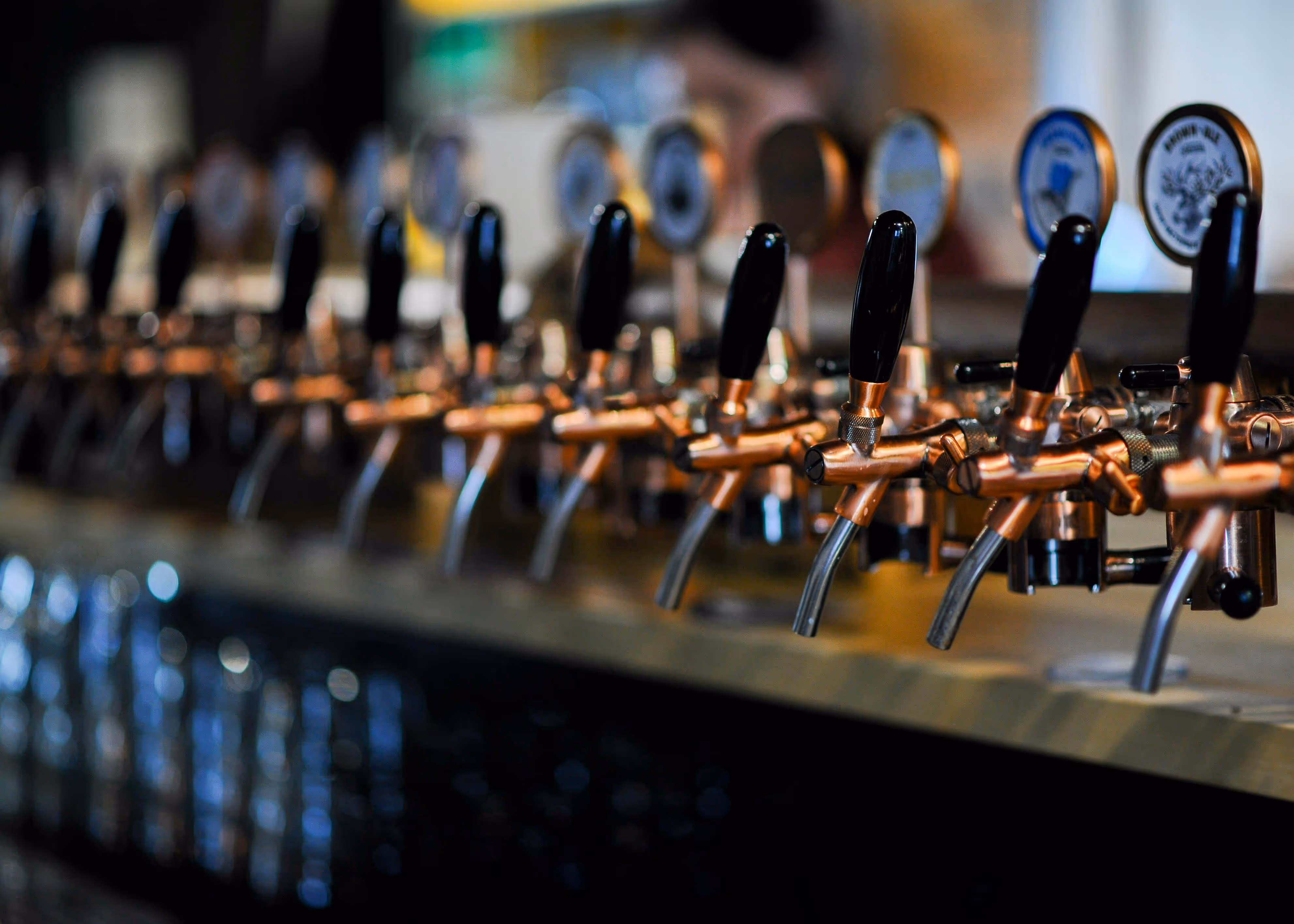 Row of beer taps pouring a variety of craft beers at Old Route 69 Brewery in Ada, Ohio.