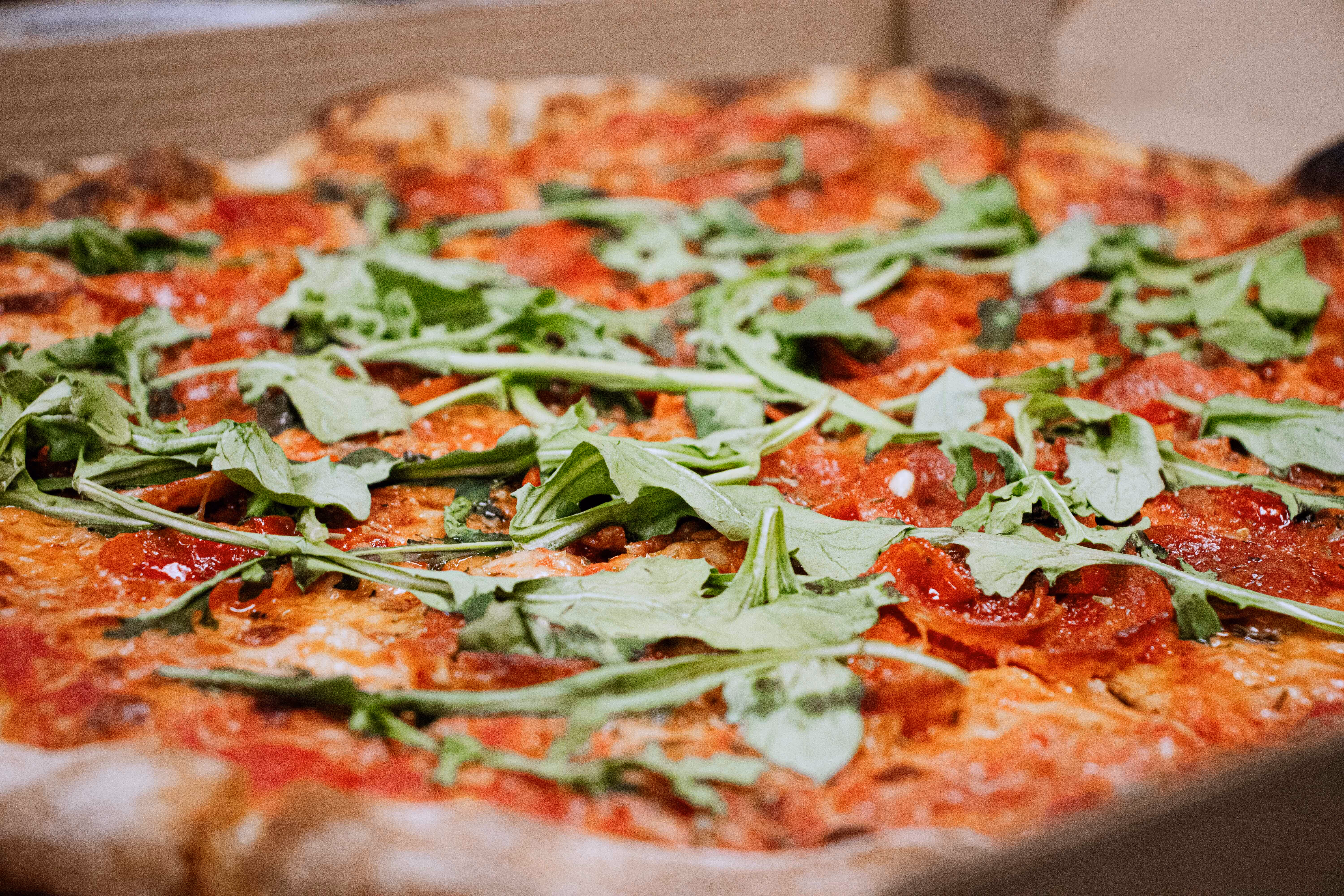 Artisan pizza from Old Route 69 Brewery in Ada, Ohio, featuring a golden-brown crust, melted cheese, and savory toppings, served hot and fresh from the kitchen.