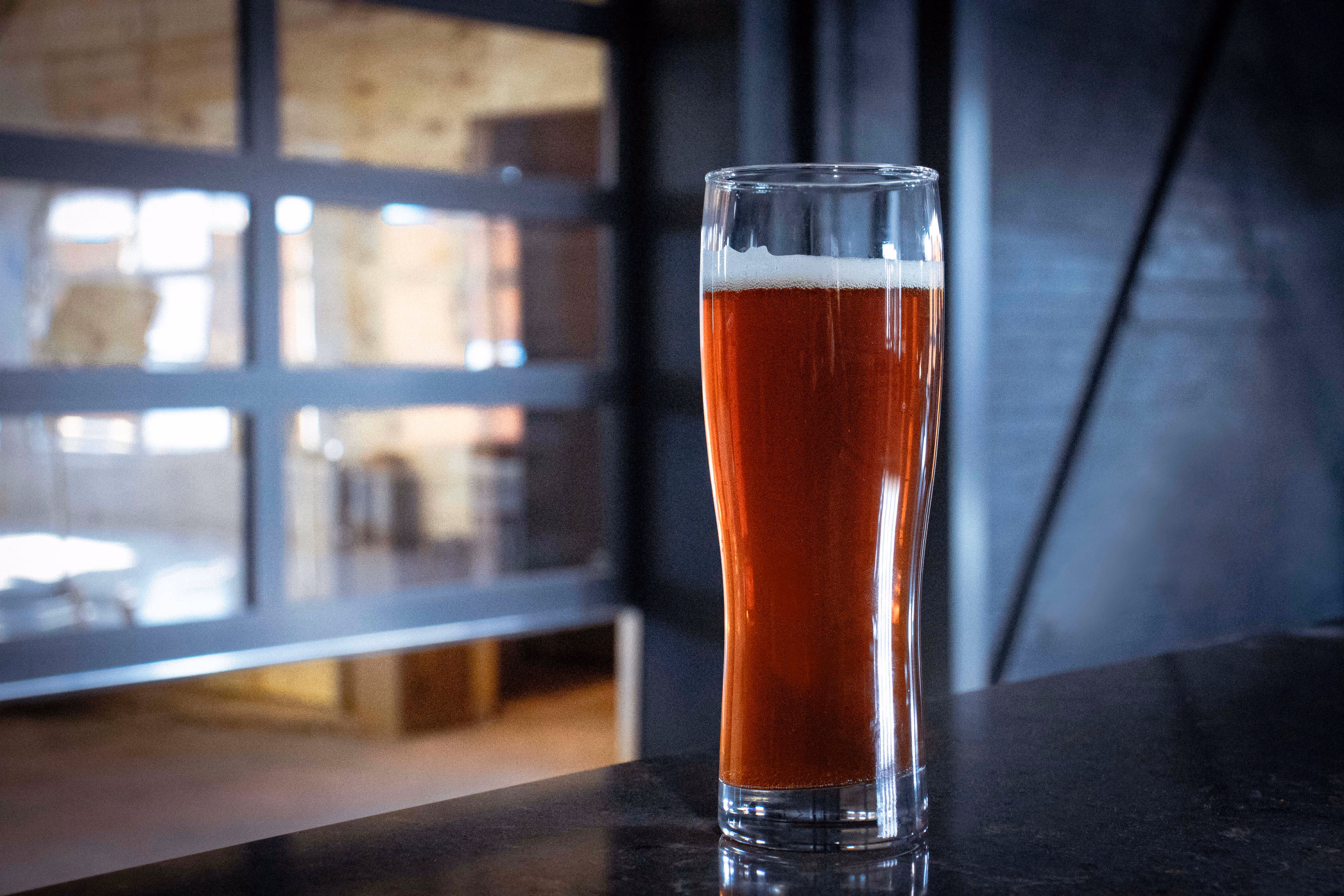 Pint glass filled with house-brewed craft beer from Old Route 69 Brewery in Ada, Ohio, showcasing the brewery’s signature pour with rich color and a foamy head.