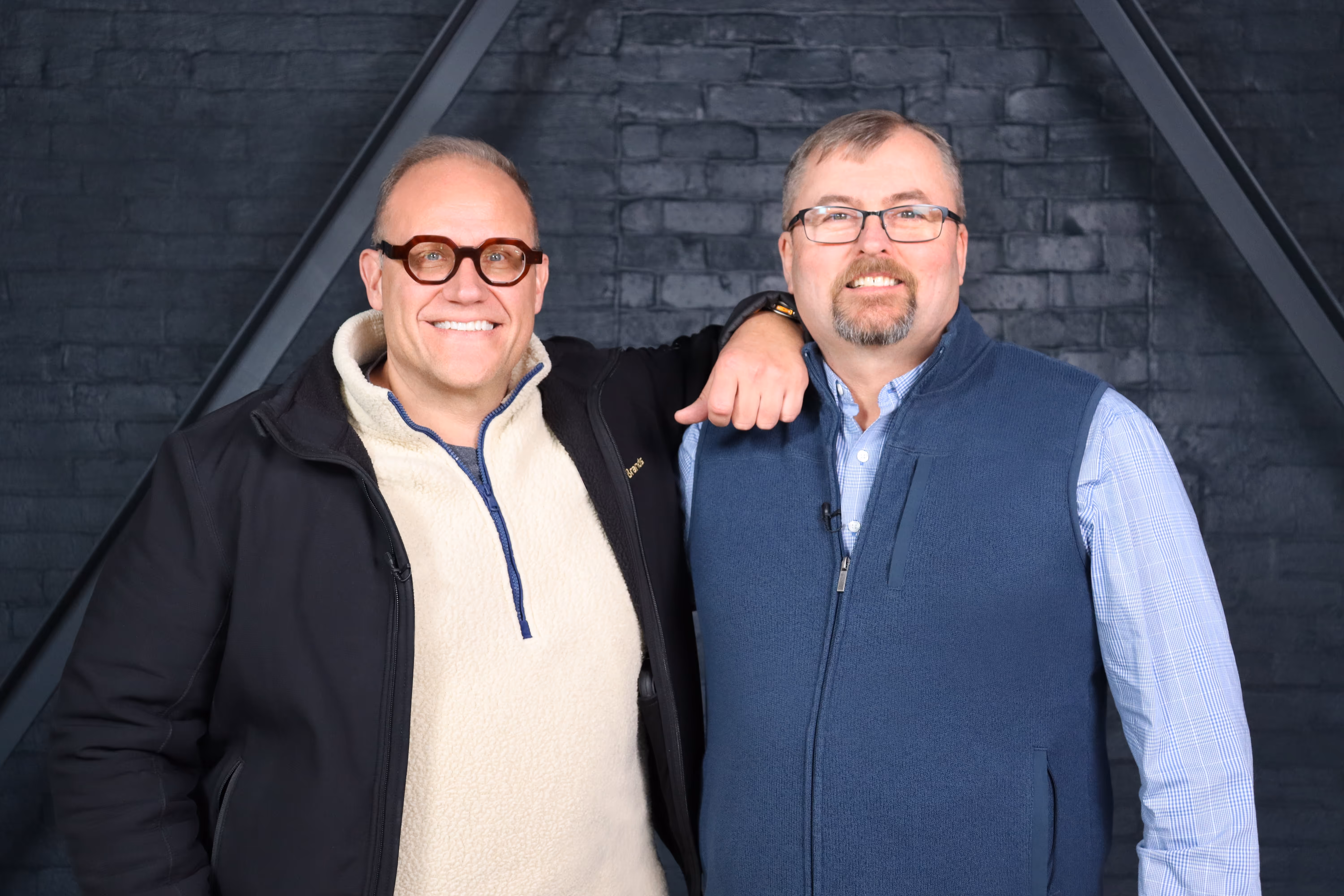 Old Route 69 Brewery founders Billy Watterson (left) and Troy Erickson (right) standing side by side at the brewery in Ada, Ohio.