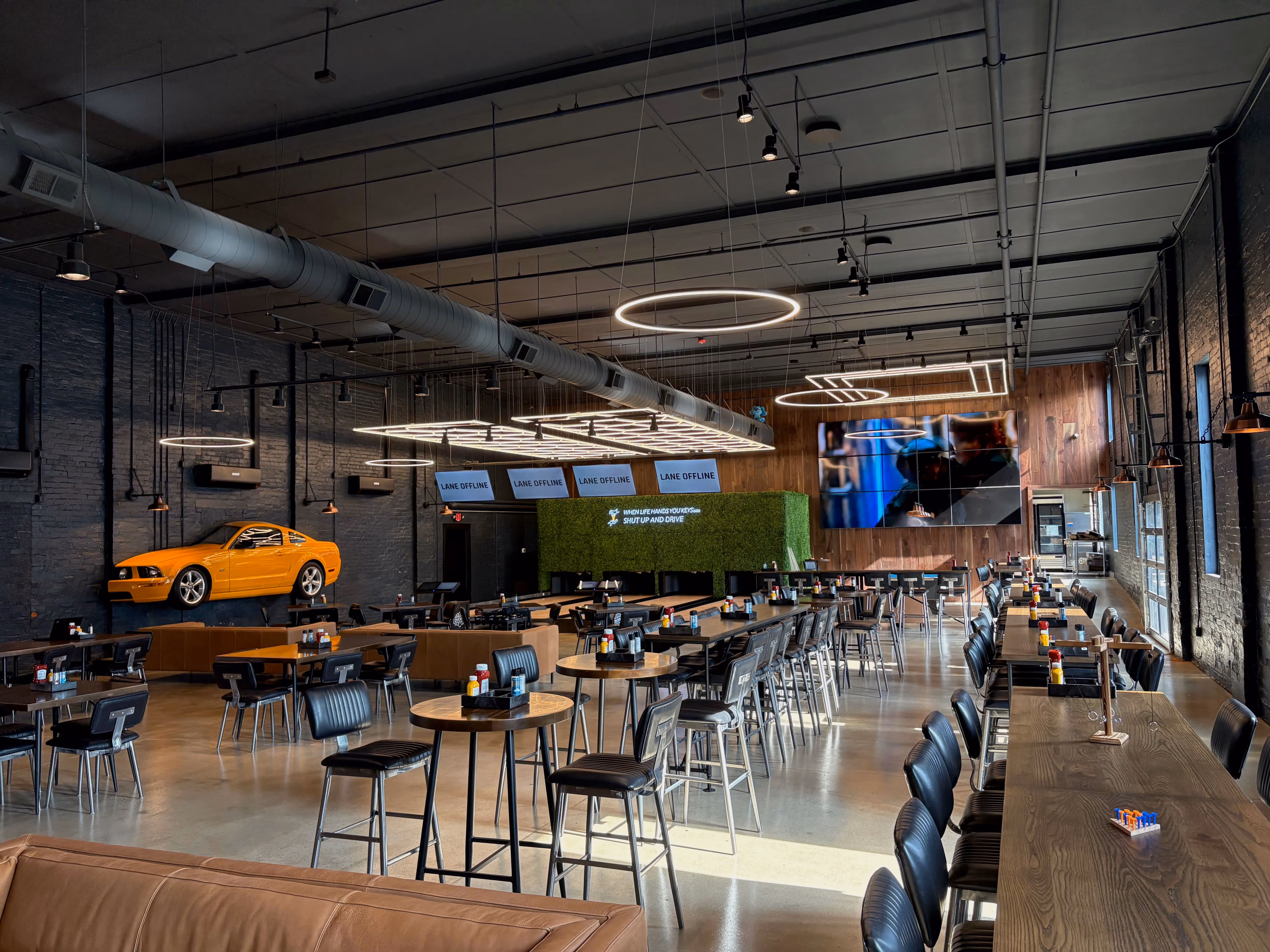Old Route 69 Brewery game and dining room featuring duckpin bowling lanes, casual seating, and a vibrant social atmosphere in Ada, Ohio.
