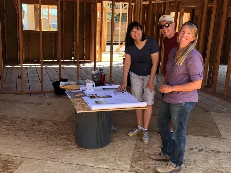 Jennifer with clients in new home