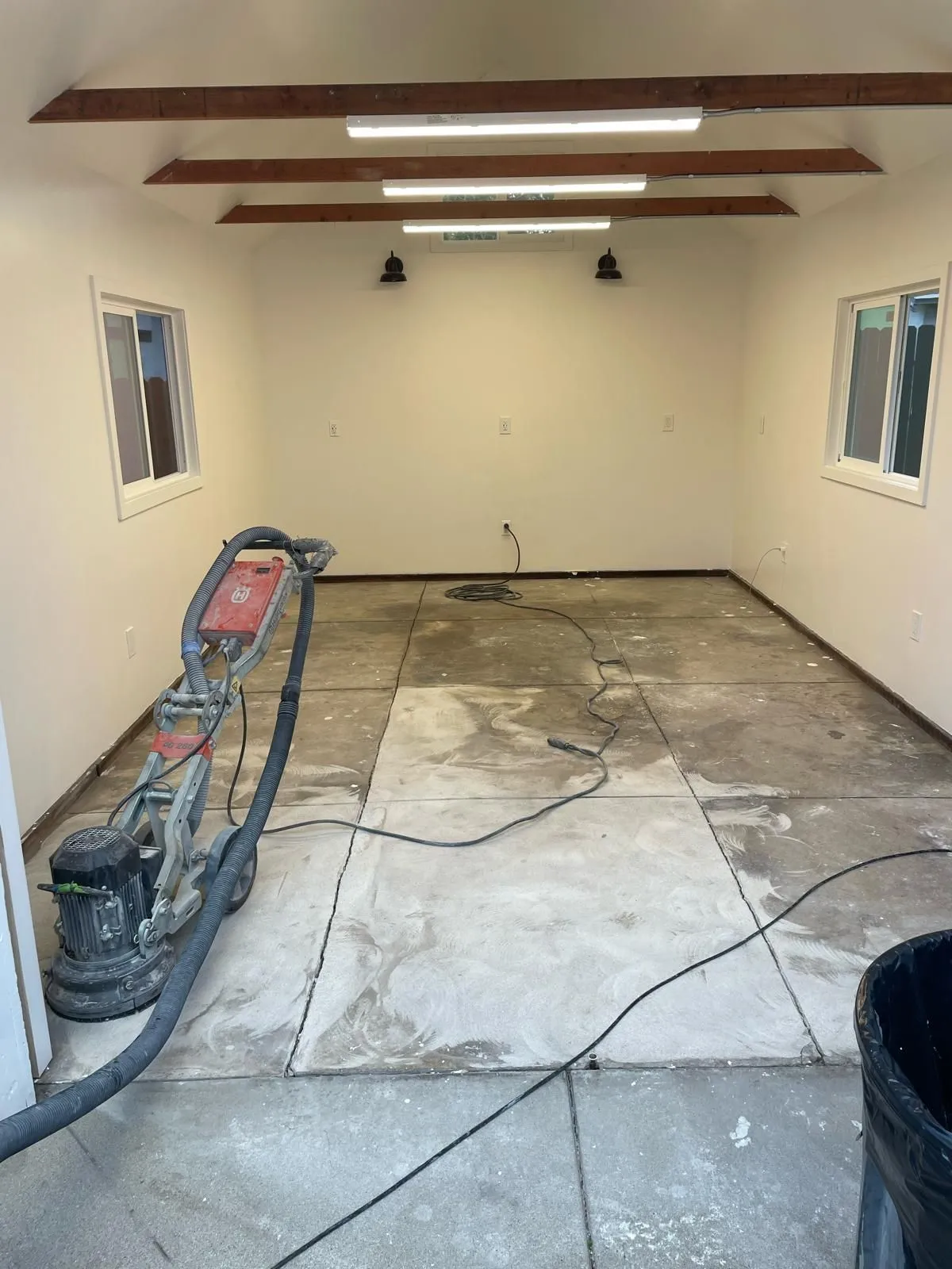 Bare garage slab prepared for coating by Epoxy Surface Professionals