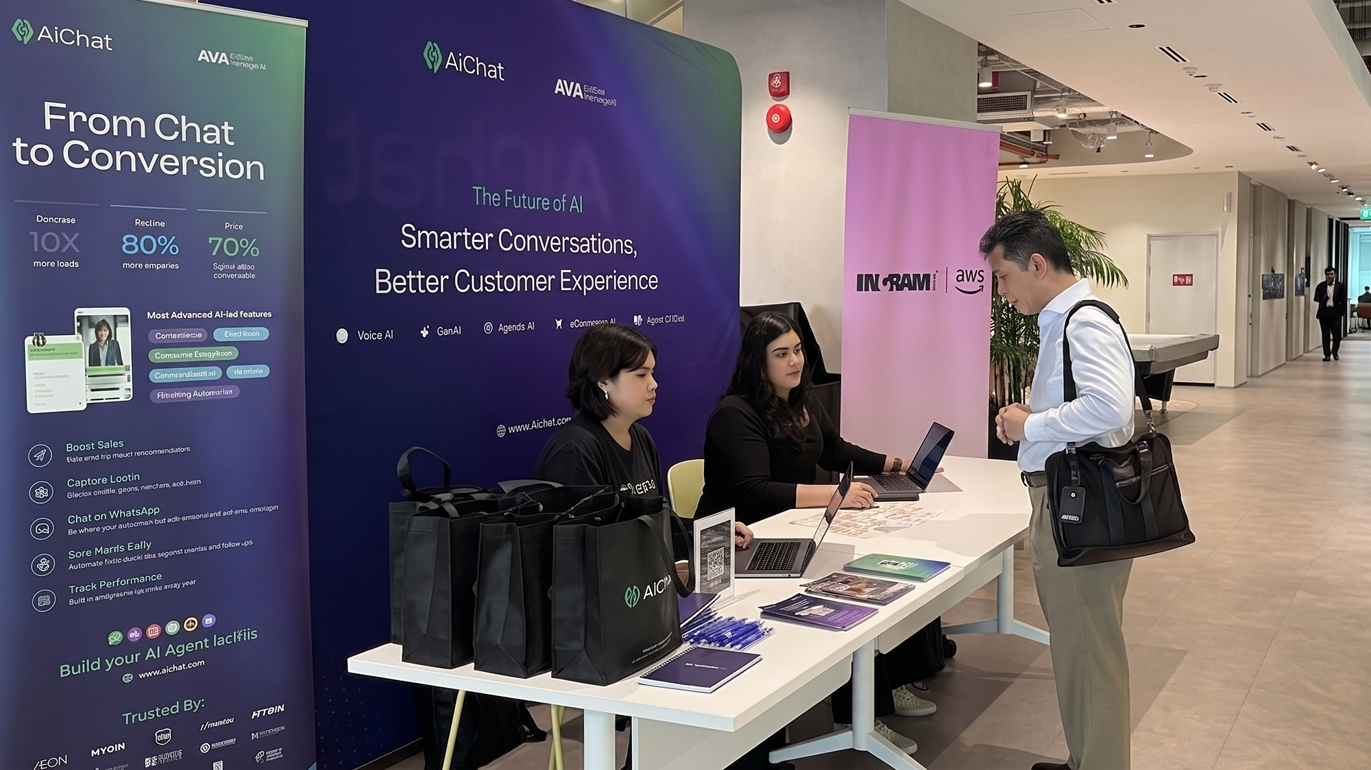 AiChat and Kemana reception booth at AWS Singapore welcoming retail leaders to the Conversational Commerce Unlocked 2026 launch event.