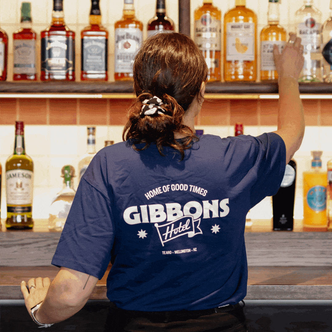 A rotating GIF image of a staff member wearing a Gibbons tshirt, and a menu displaying lunch items