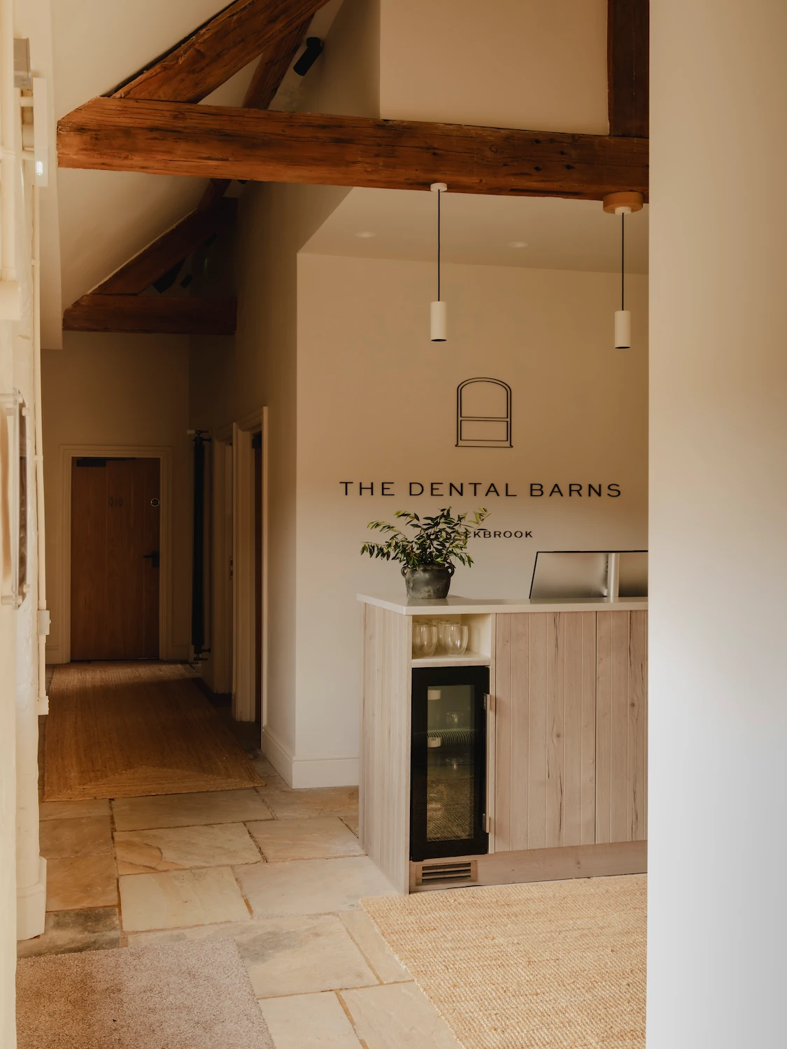 Welcoming reception and boutique entrance at The Dental Barns Lichfield, providing premium cosmetic dentistry, Invisalign, and porcelain veneers for patients in Sutton Coldfield.