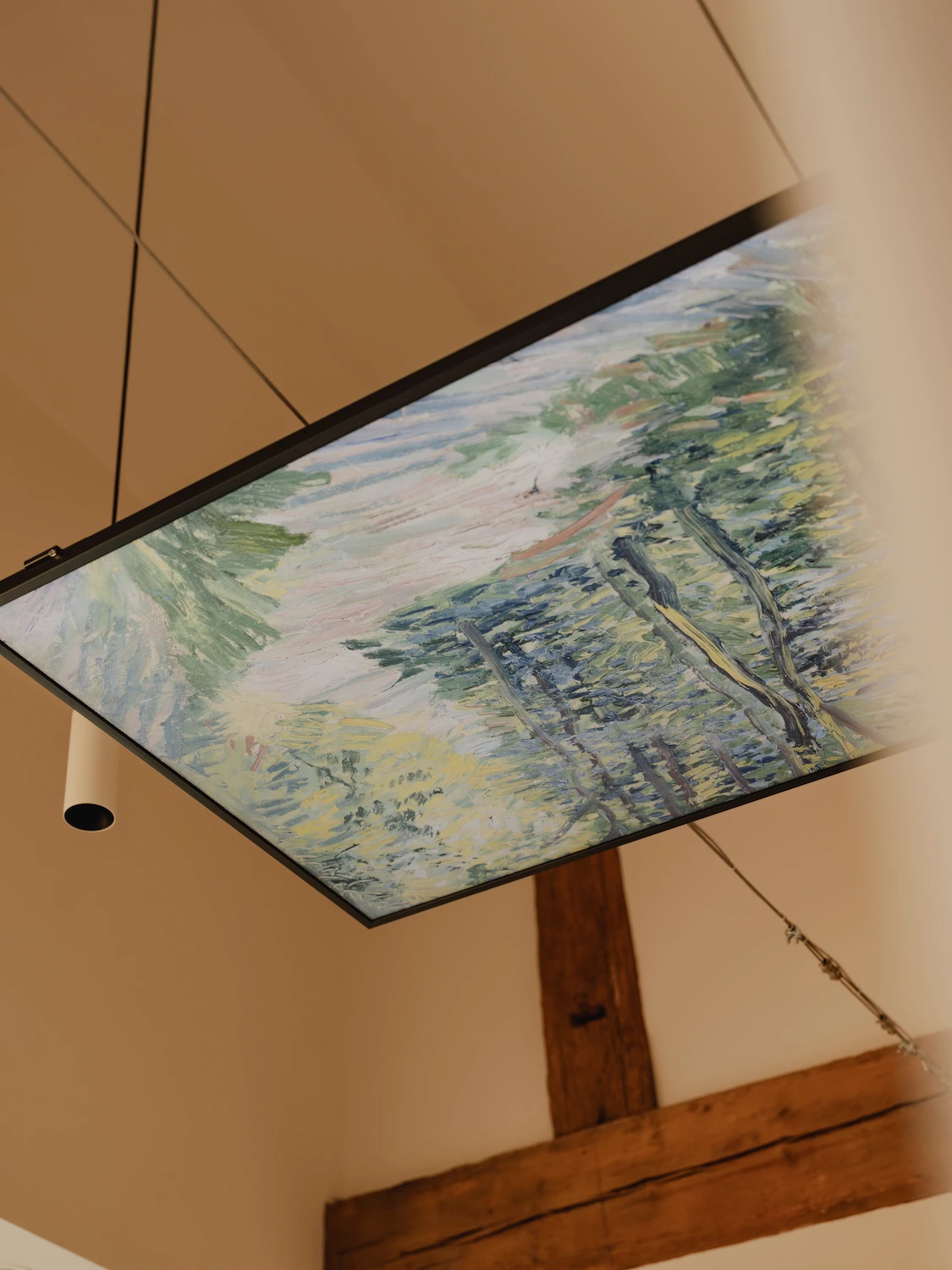 65 inch Samsung Frame TV suspended from the ceiling for patient relaxation during Invisalign, composite bonding, and veneer treatments at The Dental Barns Lichfield near Sutton Coldfield.