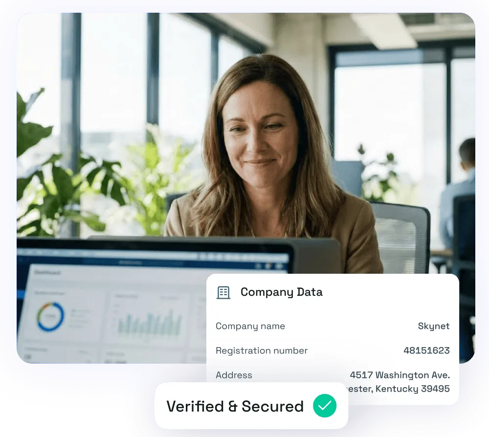 Smiling woman looking at a laptop screen showing company data with a verified and secured badge.