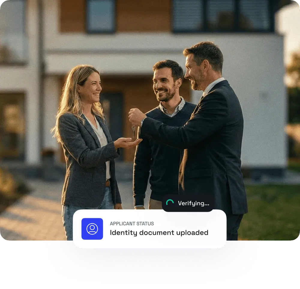 A smiling woman receives house keys from a man in a suit, with another man standing nearby, outside a modern home.