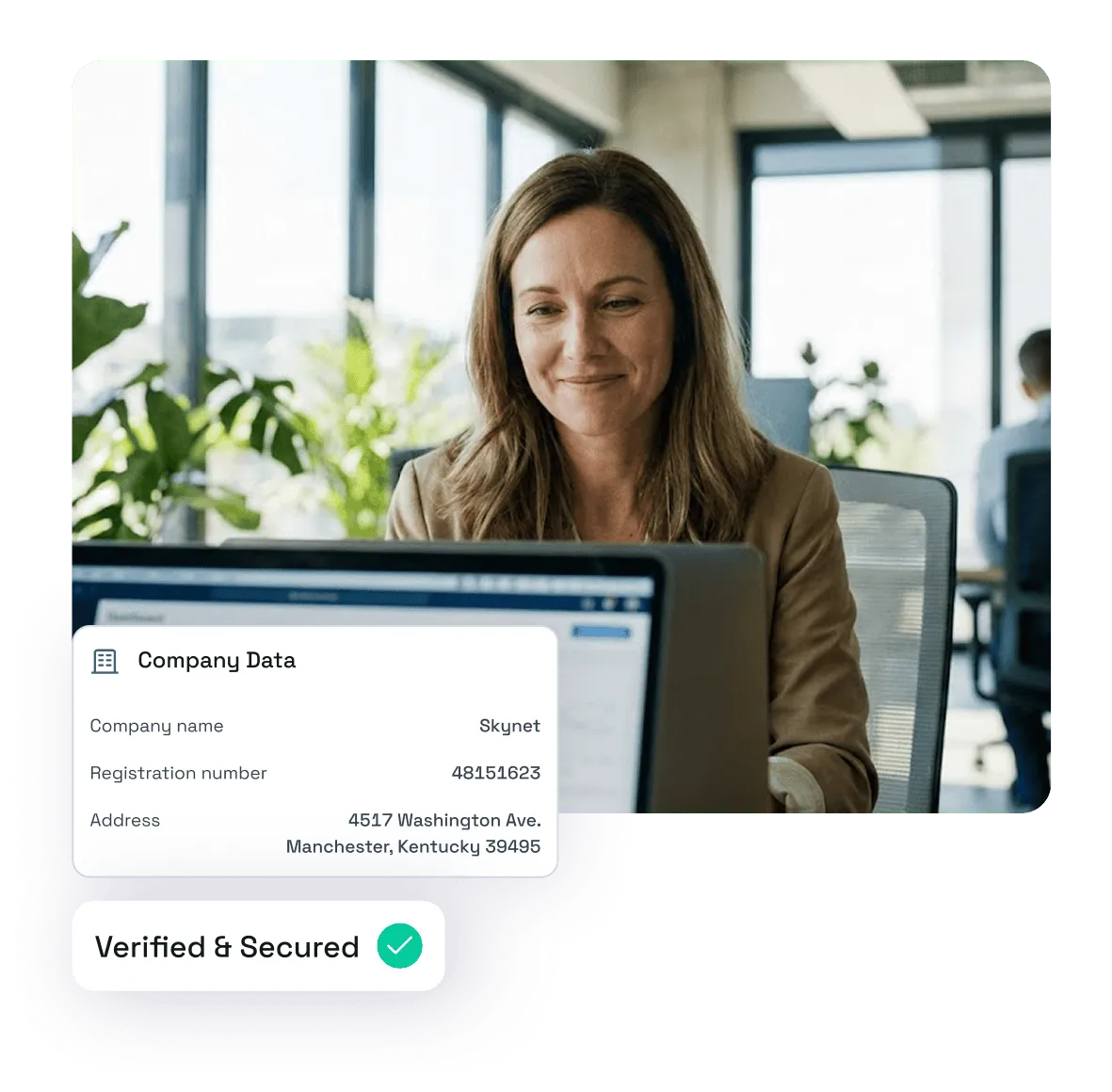 Smiling woman in office working on a laptop with an overlay showing company data, including registration number and address, marked as verified and secured.