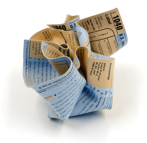 paperweight in the form of a screwed up tax form