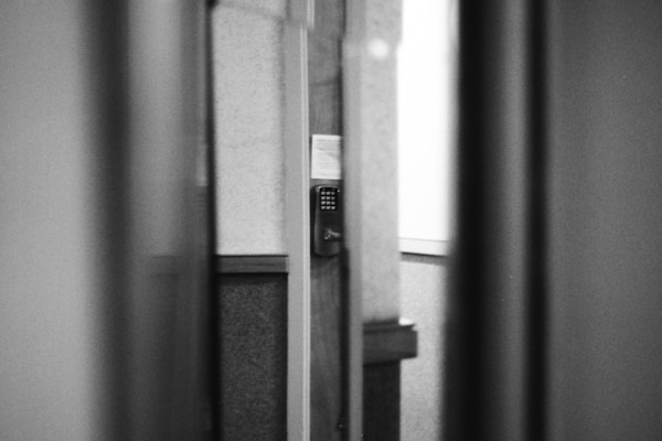 A black and white photo of an open door