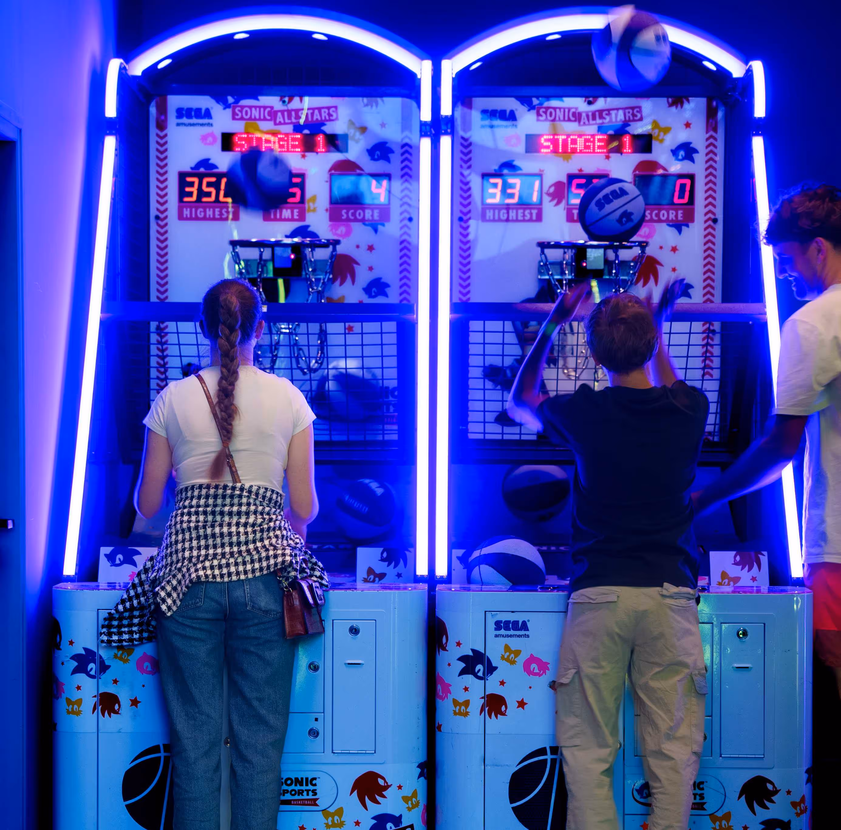 2 persons playing basket