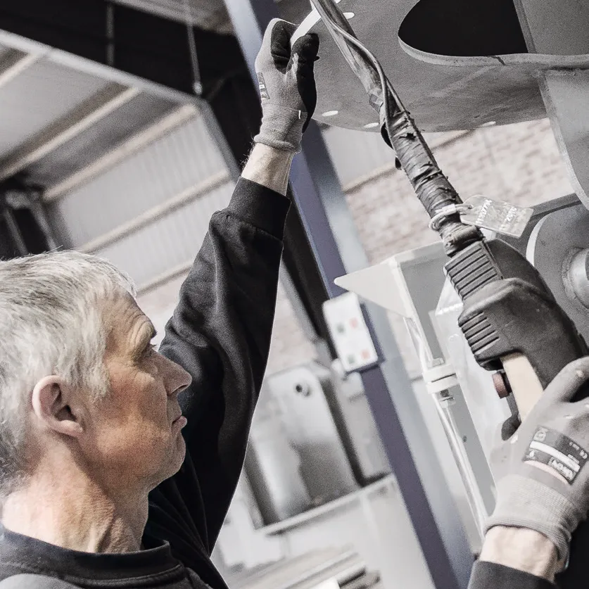Man holding a remote for a wind mill
