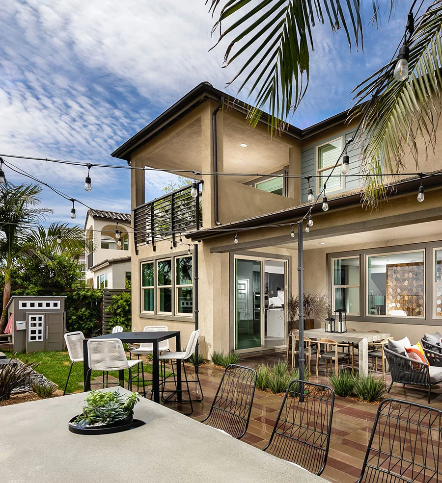 Residential projects: backyard patio with outdoor seating, a dining bar and string lights