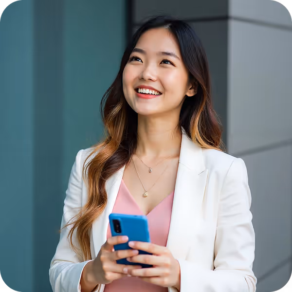 Young professional Asian Woman in a white jacket holding a device is learning about Intuitive AI Marketing for small brands.