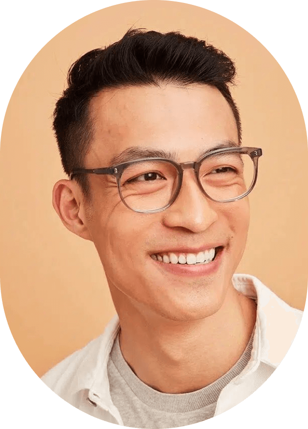 A man wearing glasses and a white shirt.