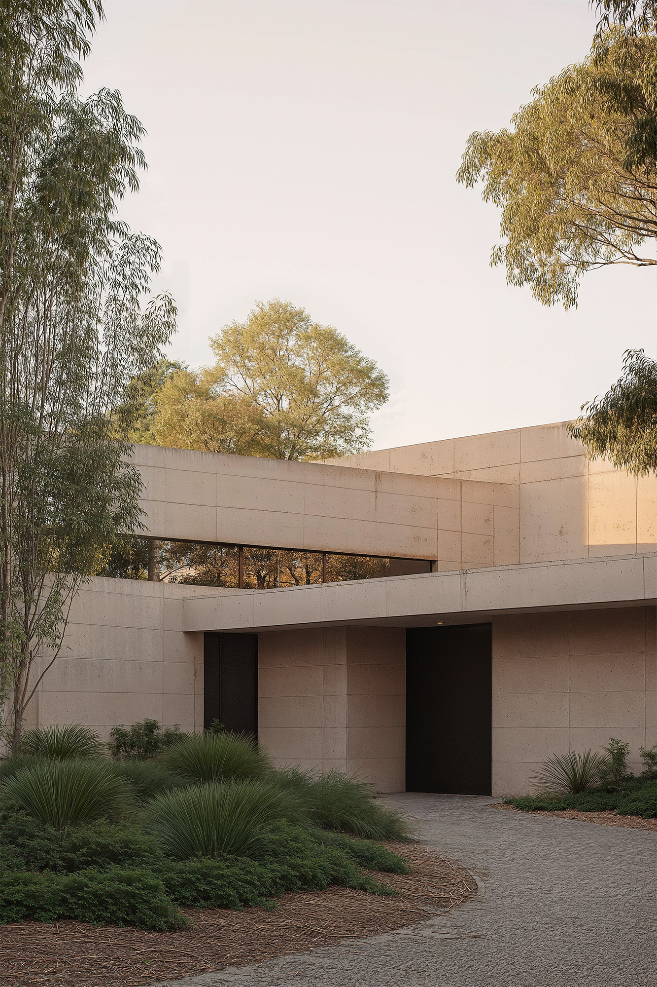 Minimalist concrete house with clean geometric lines and native landscaping — modern residential architecture surrounded by nature and designed with brutalist aesthetic