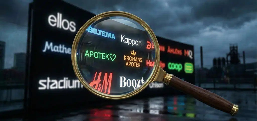 Förstoringsglas framför butikers loggor