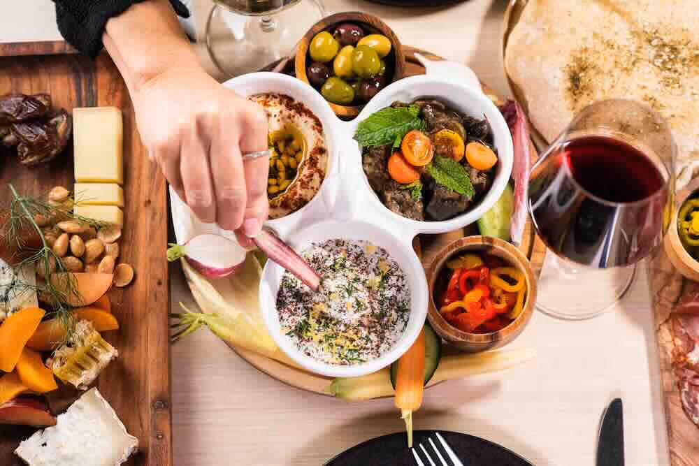 A spread of dips from our craft kitchen. Close to Disney, NBCUniversal, and Warner Brothers Santuari's Kitchen is dynamic and unique. 