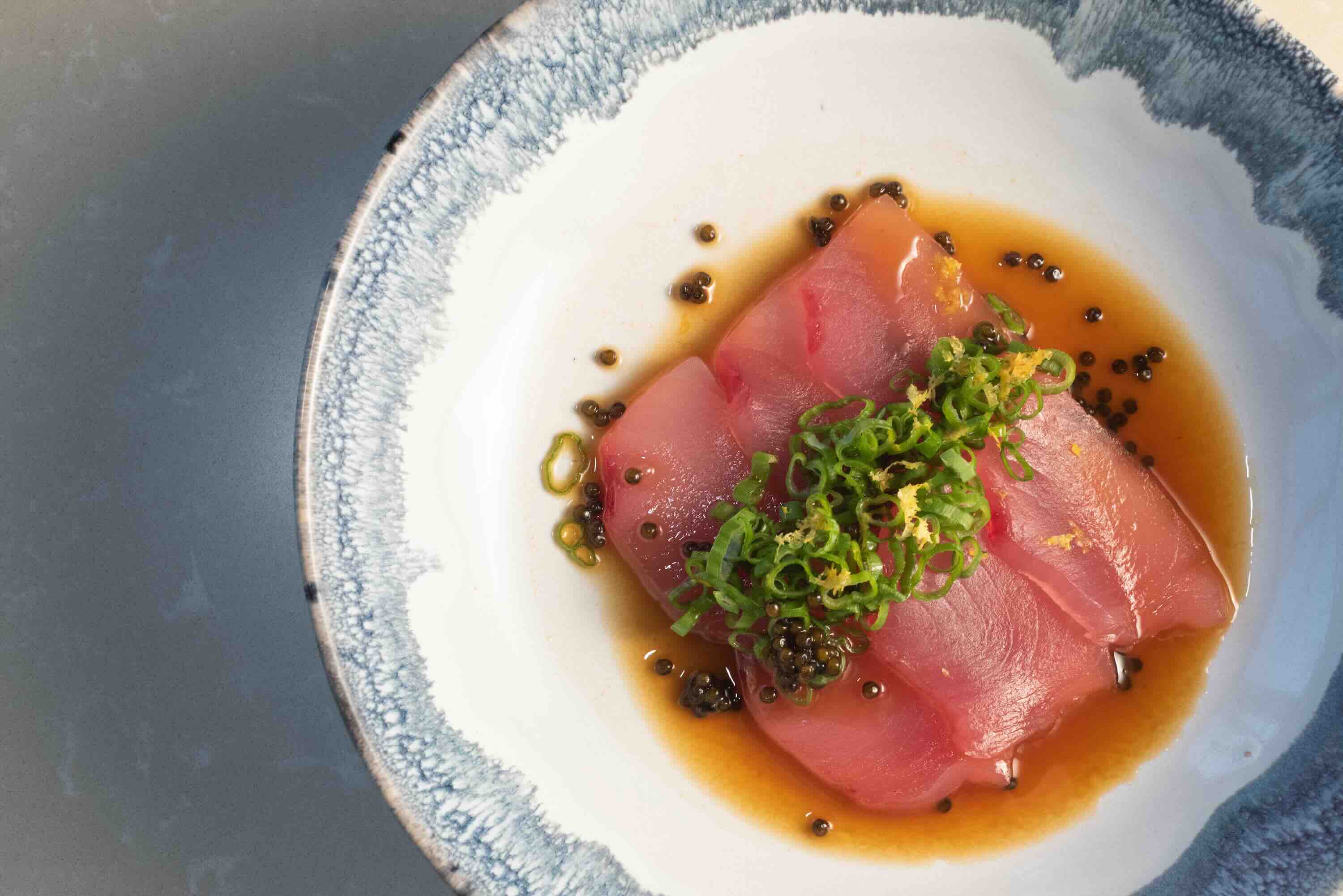 Fresh yellowfin tuna crudo with caviar, green onions, and citrus zest served at Santuari LA in-house catering in Toluca Lake